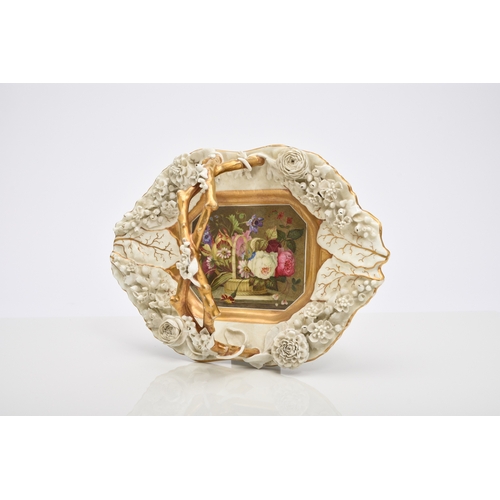 136 - A Rockingham porcelain basket, circa 1835, of canted rectangular form with central entwined handle, ... 