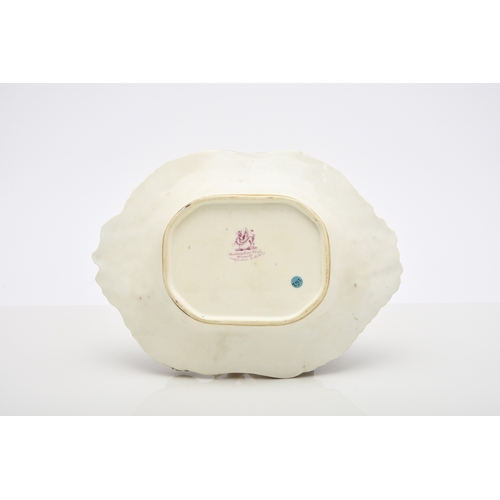 136 - A Rockingham porcelain basket, circa 1835, of canted rectangular form with central entwined handle, ... 