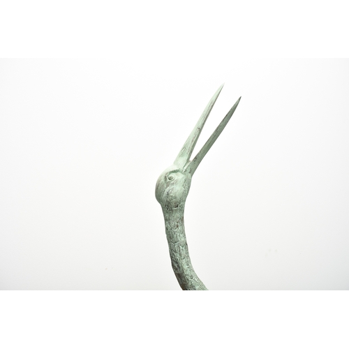 223 - A pair of bronze garden statues of crane birds, 20th century Both modelled standing, one with head r... 