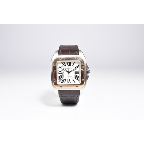 56 - Cartier: A gentleman's stainless steel and 18ct gold wristwatch Model: Santos 100 Reference: 2878 Da... 