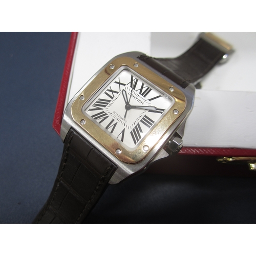 56 - Cartier: A gentleman's stainless steel and 18ct gold wristwatch Model: Santos 100 Reference: 2878 Da... 
