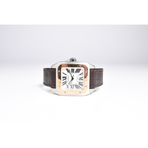 56 - Cartier: A gentleman's stainless steel and 18ct gold wristwatch Model: Santos 100 Reference: 2878 Da... 
