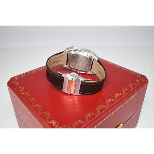 56 - Cartier: A gentleman's stainless steel and 18ct gold wristwatch Model: Santos 100 Reference: 2878 Da... 