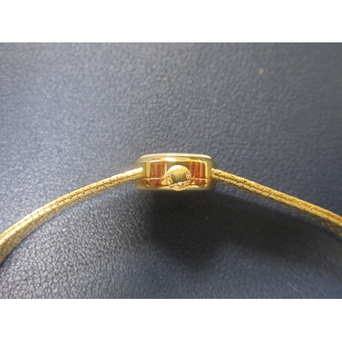 58 - Longines: A lady's 18ct gold bracelet watch Date: Circa 1968 Movement: Cal.320, 17-jewel, manual Dia... 