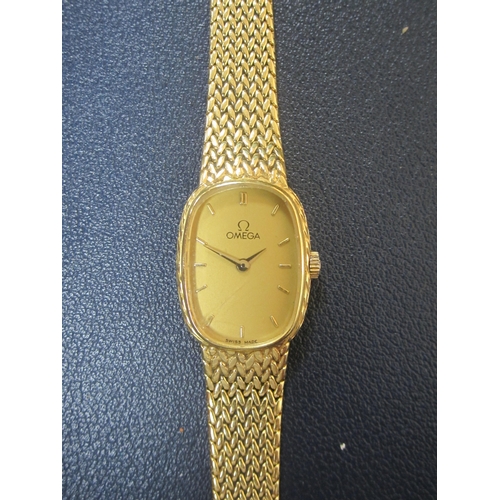 61 - Omega: A lady's 18ct gold bracelet watch Reference: 791.338 Date: Circa 1982 Movement: Omega Cal.145... 