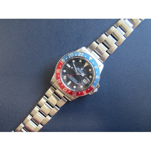 63 - Rolex: A gentleman's stainless steel automatic calendar dual-time bracelet watch
Model: GMT Master 
... 