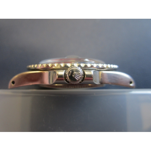 63 - Rolex: A gentleman's stainless steel automatic calendar dual-time bracelet watch
Model: GMT Master 
... 