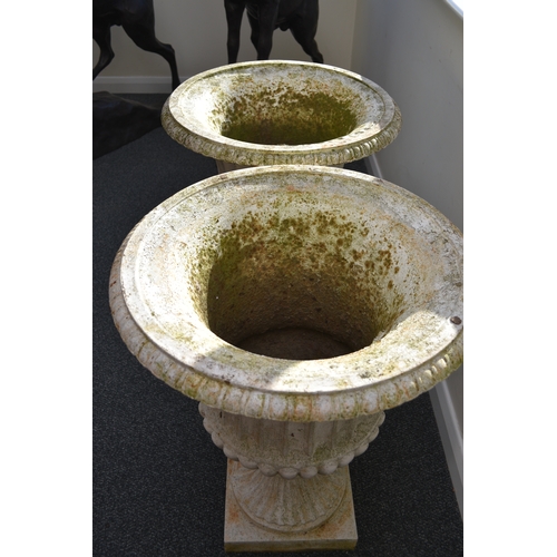 219 - A pair of cast iron garden urns, late Victorian Of campana form, painted white. 76cm high (2) Condit... 