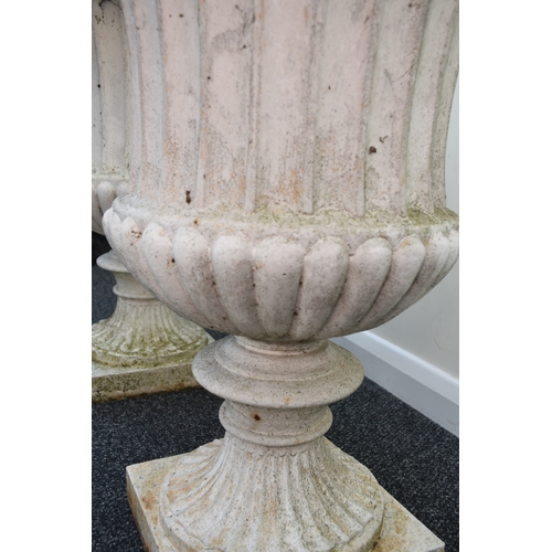 219 - A pair of cast iron garden urns, late Victorian Of campana form, painted white. 76cm high (2) Condit... 