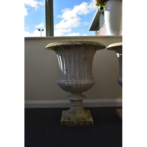 219 - A pair of cast iron garden urns, late Victorian Of campana form, painted white. 76cm high (2) Condit... 