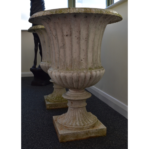 219 - A pair of cast iron garden urns, late Victorian Of campana form, painted white. 76cm high (2) Condit... 