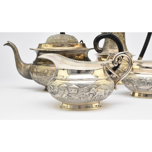 1 - A 'Sterling Silver' South East Asian four piece tea service, each piece of oval form with figural an... 