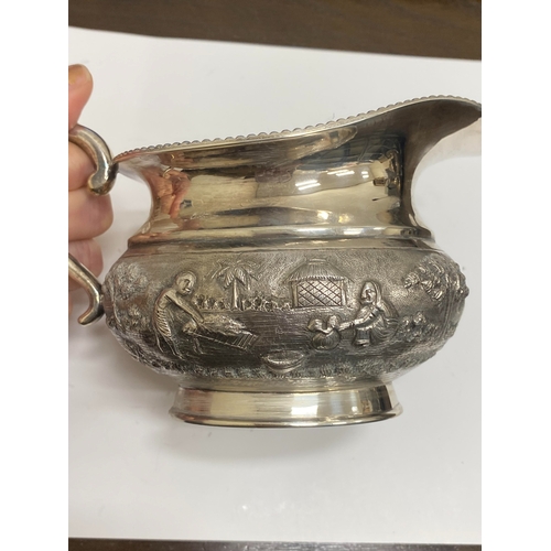 1 - A 'Sterling Silver' South East Asian four piece tea service, each piece of oval form with figural an... 