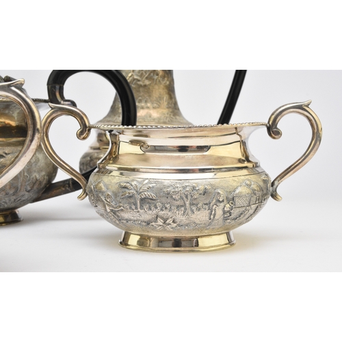 1 - A 'Sterling Silver' South East Asian four piece tea service, each piece of oval form with figural an... 