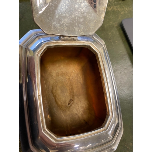 12 - A three piece silver tea service, Harrison Fisher & Co, Sheffield 1963, each piece of canted rectang... 