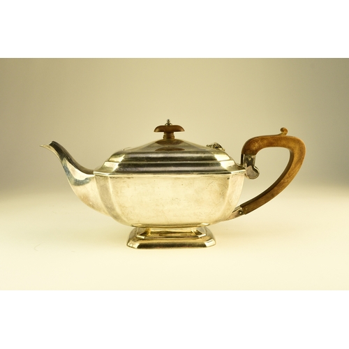 12 - A three piece silver tea service, Harrison Fisher & Co, Sheffield 1963, each piece of canted rectang... 