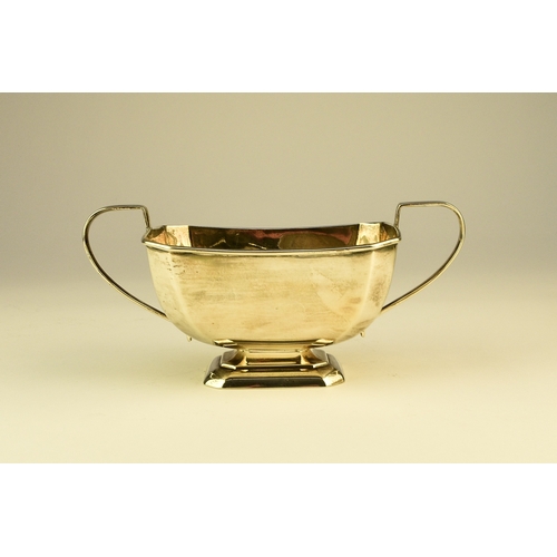 12 - A three piece silver tea service, Harrison Fisher & Co, Sheffield 1963, each piece of canted rectang... 