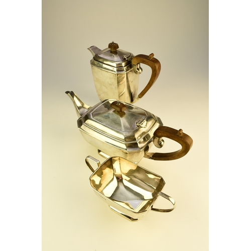 12 - A three piece silver tea service, Harrison Fisher & Co, Sheffield 1963, each piece of canted rectang... 