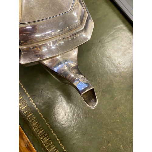 12 - A three piece silver tea service, Harrison Fisher & Co, Sheffield 1963, each piece of canted rectang... 