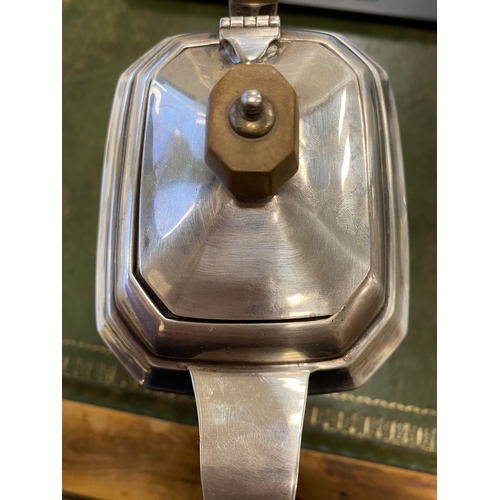 12 - A three piece silver tea service, Harrison Fisher & Co, Sheffield 1963, each piece of canted rectang... 