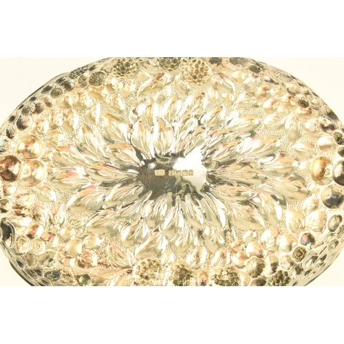 14 - A Victorian silver embossed bowl, Atkin Brothers, Sheffield 1889, of shaped oval form with repoussé ... 