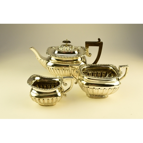 16 - An Edwardian three piece silver tea service, William Aitken, Birmingham 1907, each of rounded rectan... 