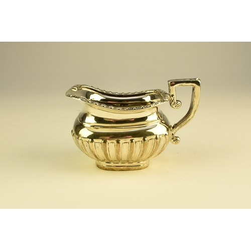 16 - An Edwardian three piece silver tea service, William Aitken, Birmingham 1907, each of rounded rectan... 