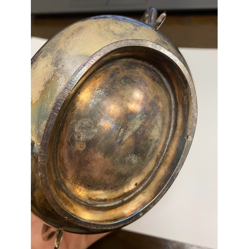 2 - A white metal hot water jug, of oval half reeded form with ebony handle and finial, 23.5cm high, rai... 