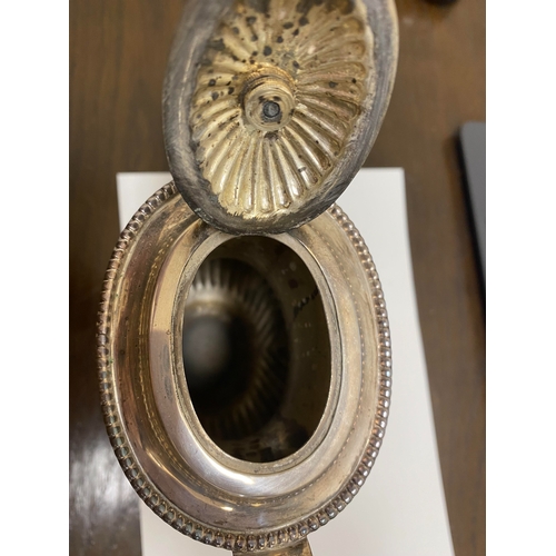 2 - A white metal hot water jug, of oval half reeded form with ebony handle and finial, 23.5cm high, rai... 