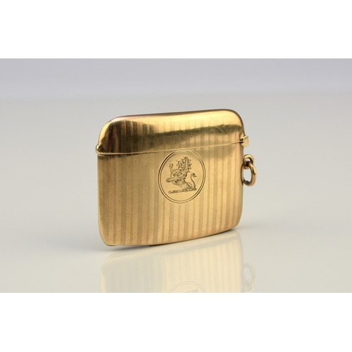 20 - A George V 9ct gold vesta case, Henry Matthews, Chester 1910, of elongated rectangular form with eng... 