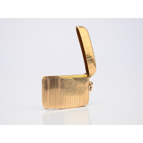 20 - A George V 9ct gold vesta case, Henry Matthews, Chester 1910, of elongated rectangular form with eng... 