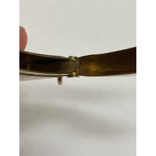 20 - A George V 9ct gold vesta case, Henry Matthews, Chester 1910, of elongated rectangular form with eng... 