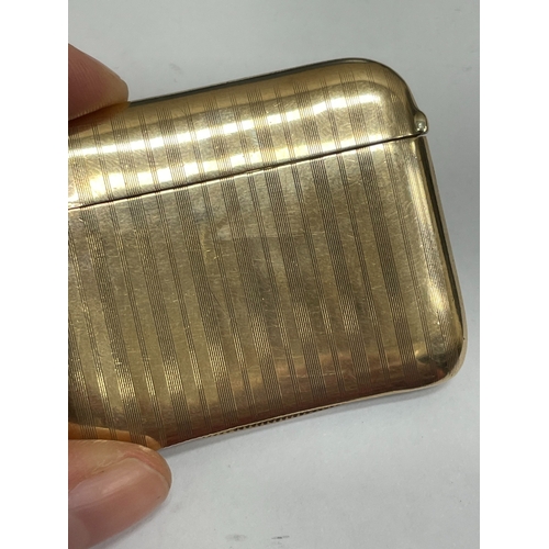 20 - A George V 9ct gold vesta case, Henry Matthews, Chester 1910, of elongated rectangular form with eng... 
