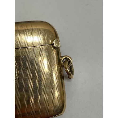 20 - A George V 9ct gold vesta case, Henry Matthews, Chester 1910, of elongated rectangular form with eng... 