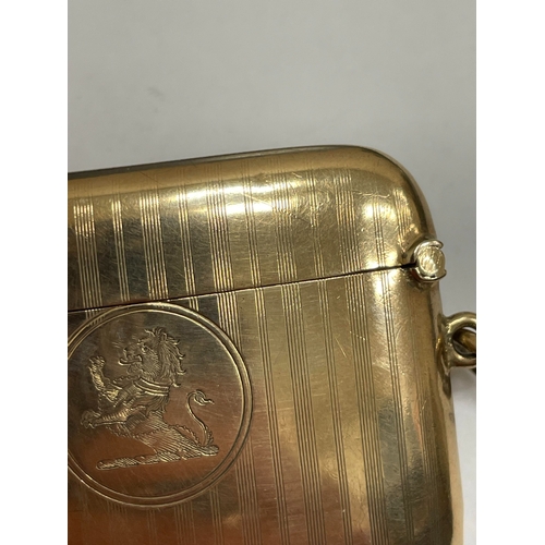 20 - A George V 9ct gold vesta case, Henry Matthews, Chester 1910, of elongated rectangular form with eng... 
