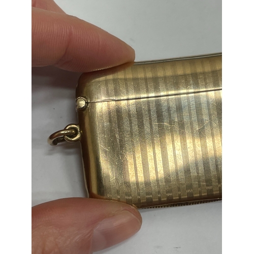 20 - A George V 9ct gold vesta case, Henry Matthews, Chester 1910, of elongated rectangular form with eng... 