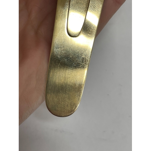 21 - A Victorian Sampson Mordan & Co 9ct gold combined bookmark / magnifier, London 1894, the book mark o... 