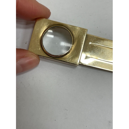 21 - A Victorian Sampson Mordan & Co 9ct gold combined bookmark / magnifier, London 1894, the book mark o... 
