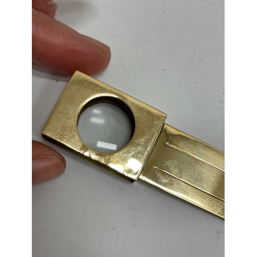 21 - A Victorian Sampson Mordan & Co 9ct gold combined bookmark / magnifier, London 1894, the book mark o... 
