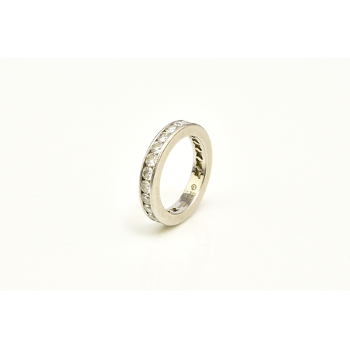27 - A De Beers platinum diamond full eternity ring, the brilliant cut diamonds channel set in platinum, ... 