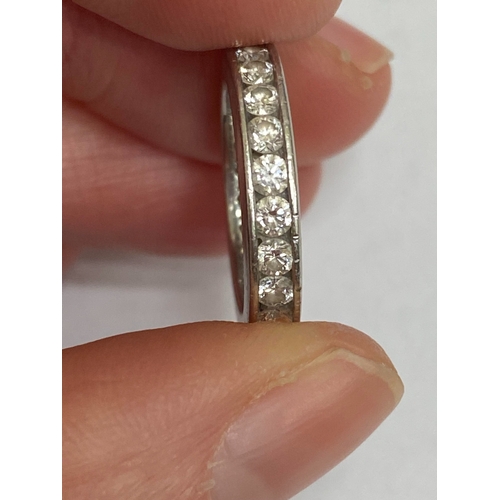 27 - A De Beers platinum diamond full eternity ring, the brilliant cut diamonds channel set in platinum, ... 