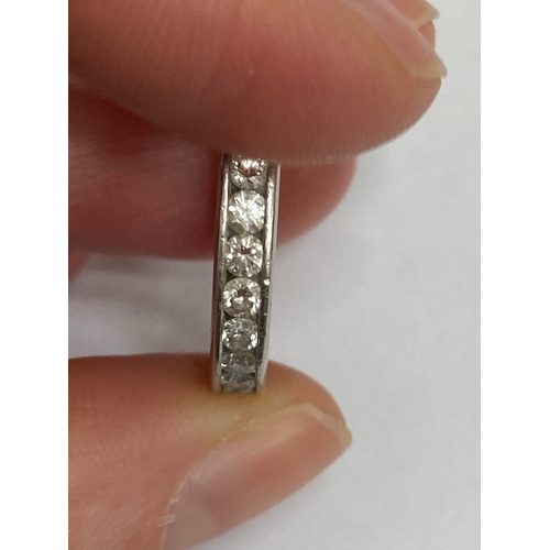 27 - A De Beers platinum diamond full eternity ring, the brilliant cut diamonds channel set in platinum, ... 