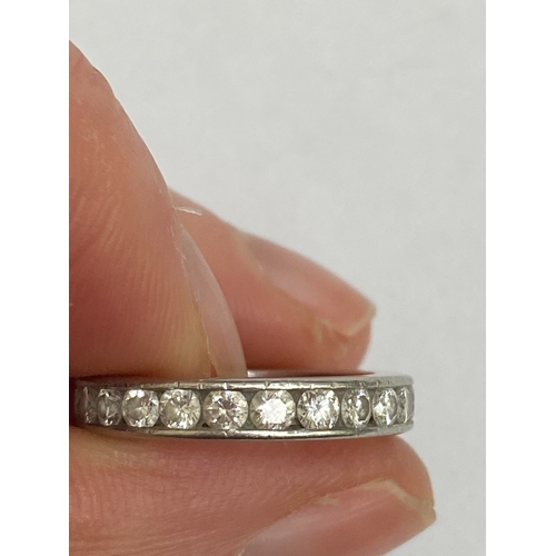 27 - A De Beers platinum diamond full eternity ring, the brilliant cut diamonds channel set in platinum, ... 