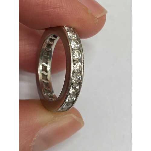 27 - A De Beers platinum diamond full eternity ring, the brilliant cut diamonds channel set in platinum, ... 