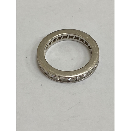 27 - A De Beers platinum diamond full eternity ring, the brilliant cut diamonds channel set in platinum, ... 