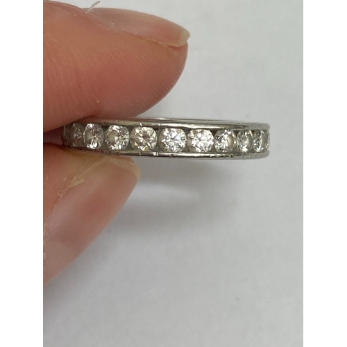 27 - A De Beers platinum diamond full eternity ring, the brilliant cut diamonds channel set in platinum, ... 