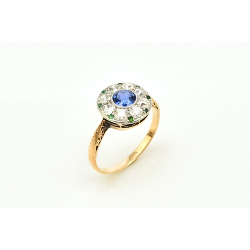 29 - An early-mid 20th century sapphire, diamond and emerald cluster ring, designed as a central round mi... 