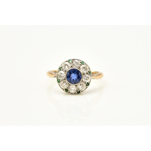 29 - An early-mid 20th century sapphire, diamond and emerald cluster ring, designed as a central round mi... 