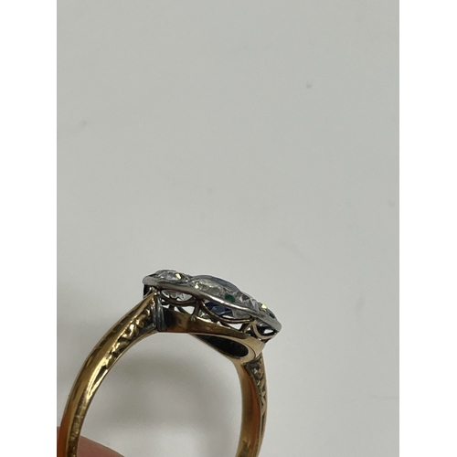 29 - An early-mid 20th century sapphire, diamond and emerald cluster ring, designed as a central round mi... 