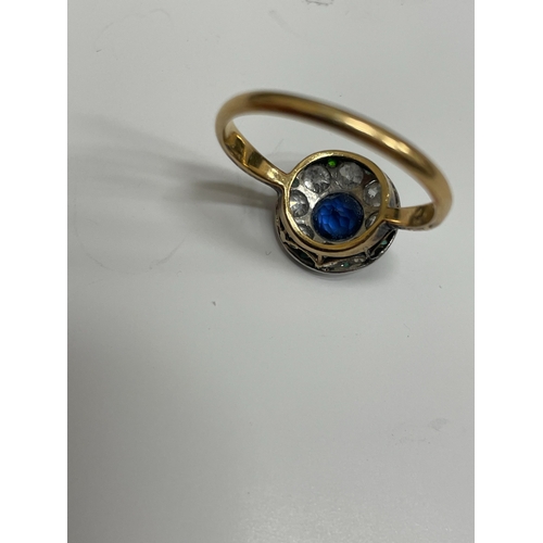 29 - An early-mid 20th century sapphire, diamond and emerald cluster ring, designed as a central round mi... 